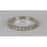 A white gold and diamond full eternity ring, mounted with circular cut diamonds, detailed '18K',