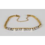 A French gold, diamond and cultured pearl curblink bracelet, the front mounted with a row of