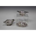 A pair of late Victorian silver bonbon baskets with pierced and embossed decoration, London 1894