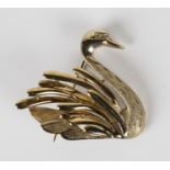 A 9ct gold and diamond brooch, designed as a swan, mounted with a circular cut diamond to the eye,