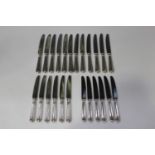 A set of twelve Elizabeth II silver hollow handled Old English Thread pattern table knives and six