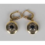 A pair of gold, sapphire and diamond pendant earrings, each oval drop mounted with an oval cut