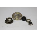 A small group of silver items, including a George V silver and tortoiseshell circular pill box and