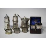 A Queen Anne style silver three-piece condiment set, comprising a pair of lighthouse salt and pepper