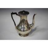 A George V silver coffee pot of baluster form, Sheffield 1912 by John Round & Son Ltd, height 26.