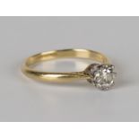 A gold and diamond single stone ring, claw set with a cushion cut diamond, detailed 'Plat.18c', ring