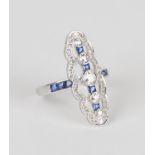 A white gold, diamond and sapphire ring, collet set with a row of five graduated circular cut