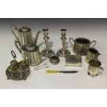 A collection of plated items, including a four-piece tea set, a four-egg cruet stand and egg cups, a