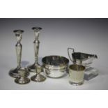 A small group of silver items, including an Edwardian sugar bowl and milk jug with reeded rims,