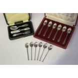 A set of six Elizabeth II silver coffee spoons, each with square section handle and nail terminal,