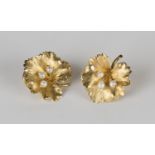 A pair of 18ct gold and cultured pearl earclips, each designed as a leaf with a textured finish,