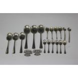 A small group of silver cutlery, including three Hanoverian Rat Tail pattern table spoons and