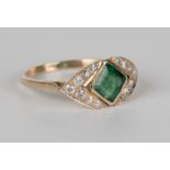 A gold, emerald and diamond ring, mounted with a square step cut emerald between circular cut