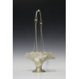 An Edwardian silver flower basket of flared form with cast ropetwist overhead handle, the rim cast