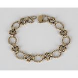 A 9ct gold bracelet in a ropetwist oval and openwork link design with a foldover clasp, length 22.