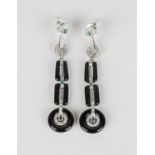 A pair of diamond, emerald and black onyx pendant earrings in an Art Deco inspired design, with post