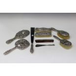 A group of silver and plated dressing table accessories, including a late Victorian hand mirror,