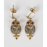 A pair of 9ct gold, ruby and diamond pendant earrings, each designed as an owl with ruby set eyes,