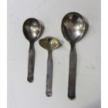 A group of three Danish Art Deco silver serving implements, comprising a pair of graduated serving