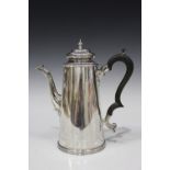 A late Victorian silver coffee pot of tapered cylindrical form with domed hinged lid and scroll