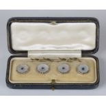 A gold, platinum, sapphire and mother-of-pearl set of four dress buttons, each octagonal front