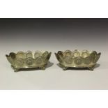 A pair of late Victorian silver oval bowls, each tapering side inset with a band of twelve