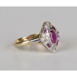 A gold, ruby and diamond lozenge shaped cluster ring, collet set with the principal oval cut ruby