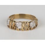 A 9ct gold and diamond ring, designed as a row of three elephants, ring size approx X, with a case.