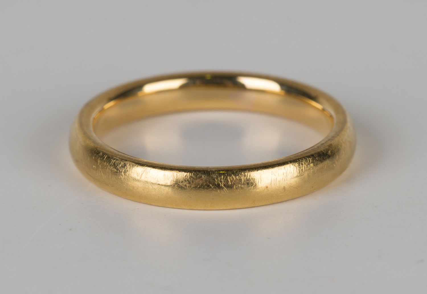 A 22ct gold plain wedding ring, London 1934, ring size approx L.Buyer’s Premium 29.4% (including VAT