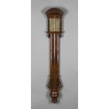 A Queen Anne style walnut veneered stick barometer, the unsigned brass dial with engraved detail and