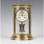 A late 19th century French oval four glass mantel clock with eight day movement striking on a