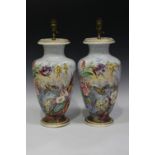 A pair of French porcelain vases, mid-19th century, each painted with a polychrome butterfly