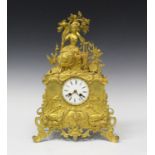 An early 19th century French ormolu cased mantel clock with eight day movement and silk