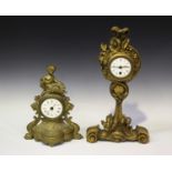 An early 20th century carved giltwood mantel timepiece, the case of slender form with floral and