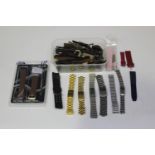 A large collection of assorted wristwatch bracelets, including steel, leather and gilt metal