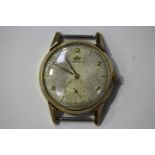 A Marvin 9ct gold circular cased gentleman's wristwatch, the indistinctly signed silvered dial