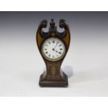 An Edwardian mahogany mantel timepiece with platform escapement and enamel circular dial, the