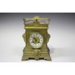 A late 19th century French brass cased mantel clock with eight day movement striking on a gong,