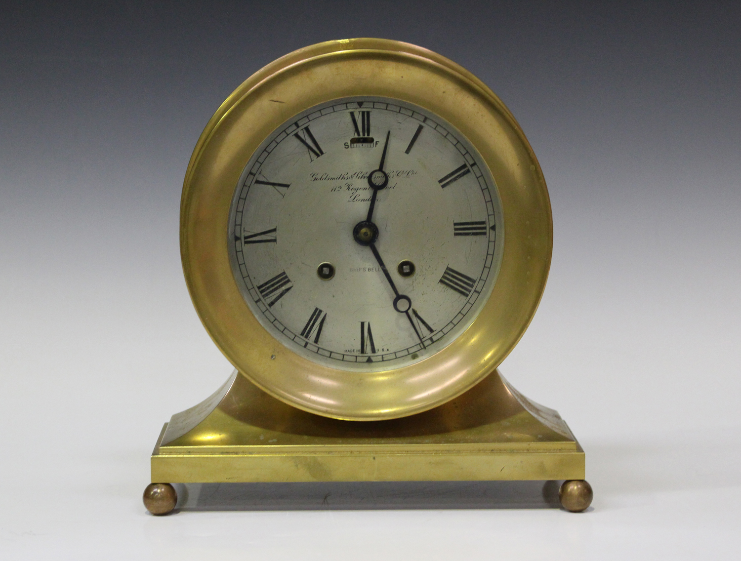 An early 20th century American bronze circular cased ship's clock mantel timepiece by Chelsea
