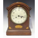 An early 20th century mahogany bracket clock with eight day movement striking on a gong, the