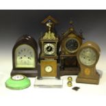 An Edwardian inlaid oak balloon shaped mantel clock case, height 28.5cm (lacking movement), together