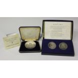 A silver proof medallion commemorating Man's First Moon Landing 1969, with case, and a pair of