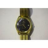 A Favre-Leuba Harpoon gilt metal fronted and steel backed gentleman's wristwatch, the signed black