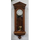 A mid to late 19th century Austrian walnut cased Vienna wall clock with eight day Lenzkirch movement