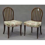 A set of six late 19th/early 20th century Continental stained beech comb back dining chairs, the