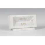 Chris Mitton - 'Brick', a modern carved Carrara marble model of a brick, numbered '123' and