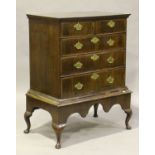A George I and later walnut chest-on-stand, fitted with two short and three long drawers, the