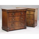 A pair of early 19th century figured mahogany chests, each fitted with four drawers flanked by