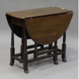 An 18th century oak oval gateleg supper table, on turned and block legs with outswept feet, height