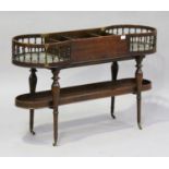 A 20th century mahogany butler's stand, in the manner of Gillows, the central cutlery tray flanked